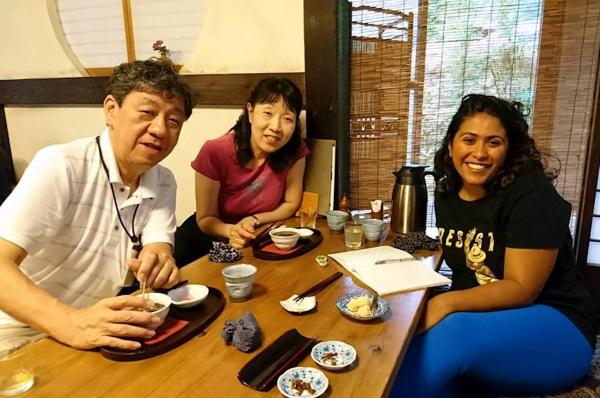 Sabrina shares a meal with her host family. 