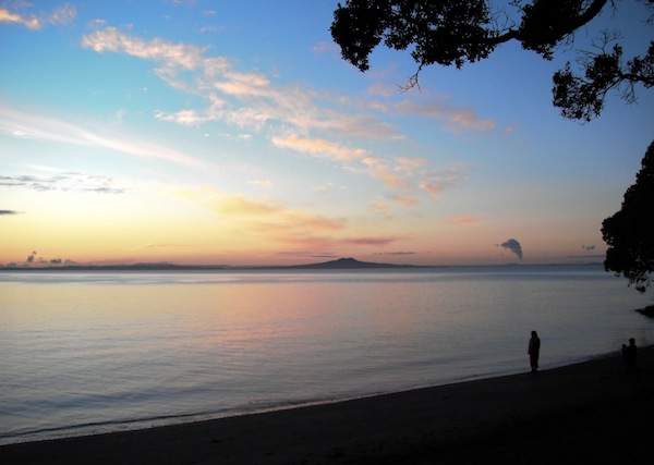 The sunrise over Little Manly Beach, New Zealand. (Photo credit: Richard Ainsworth.)